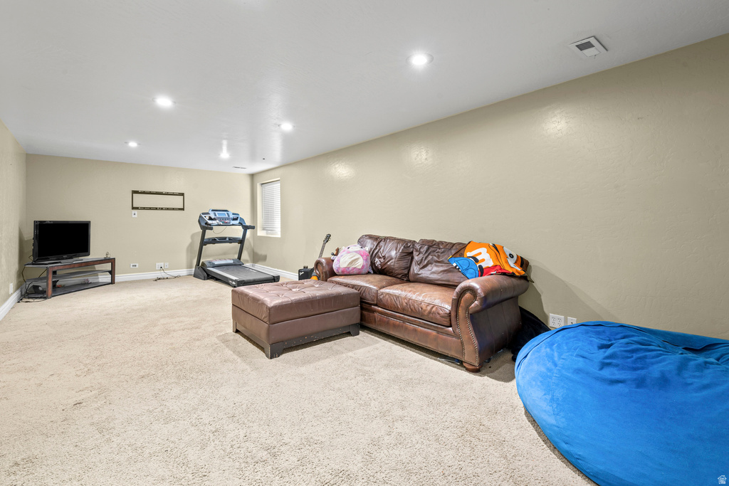 Spacious room featuring neutral carpeting and light-toned walls