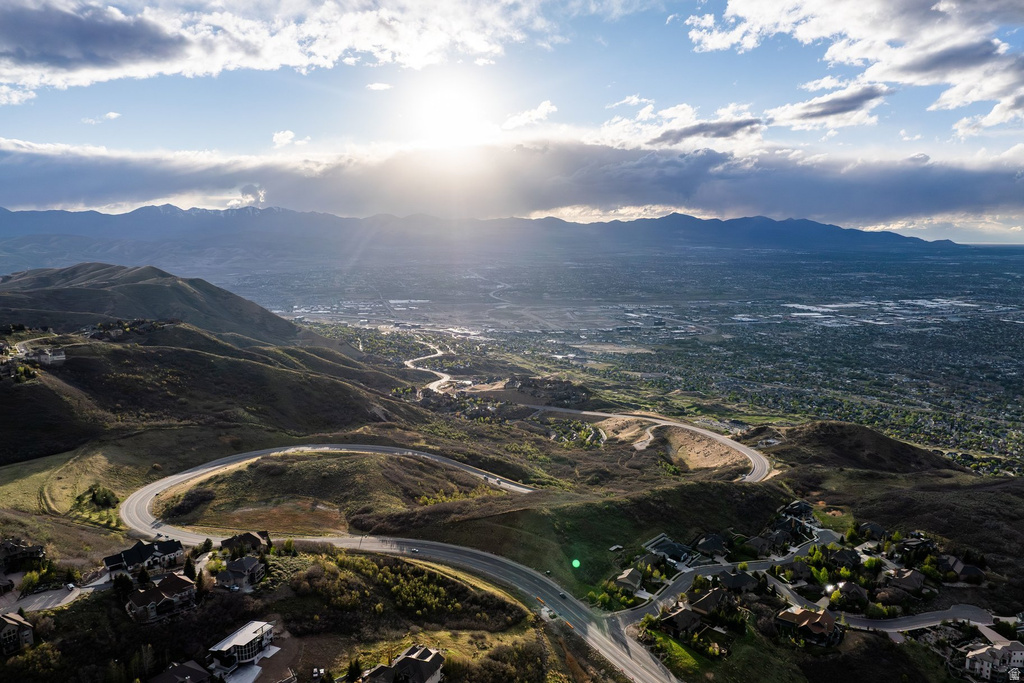 Aerial panorama showcasing a winding road through mountainous terrain