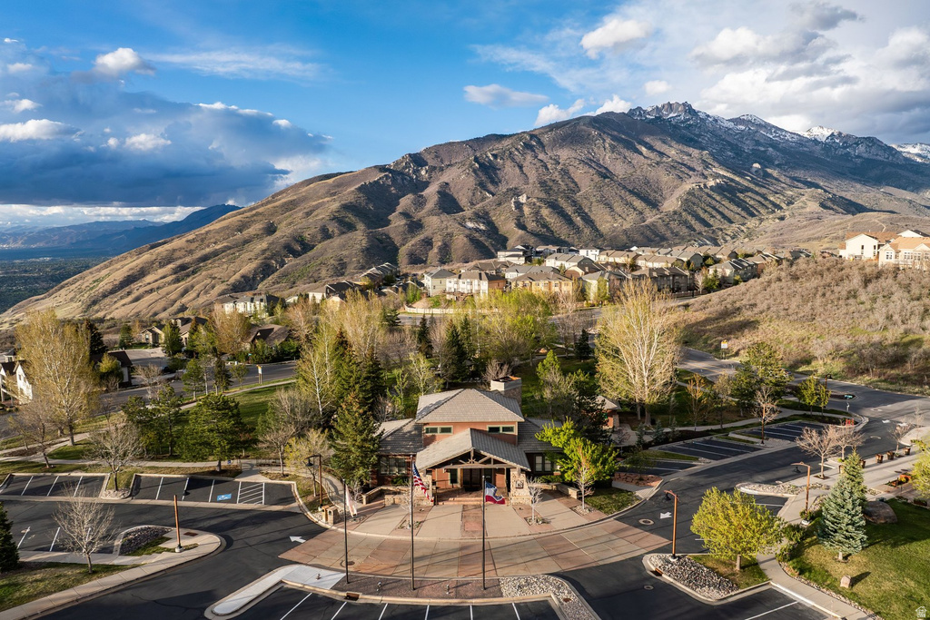 Mountainous landscape featuring residential properties and a community building