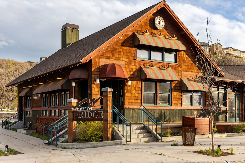 Rustic-inspired building featuring cedar shingle siding and a dark shingled roof