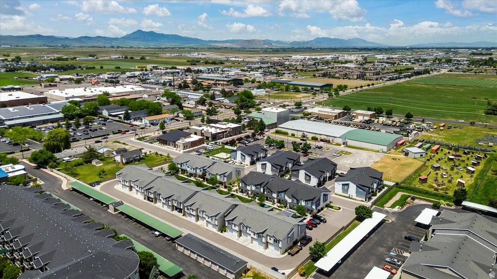 Aerial perspective showcasing a community of townhome-style residences with covered parking structures
