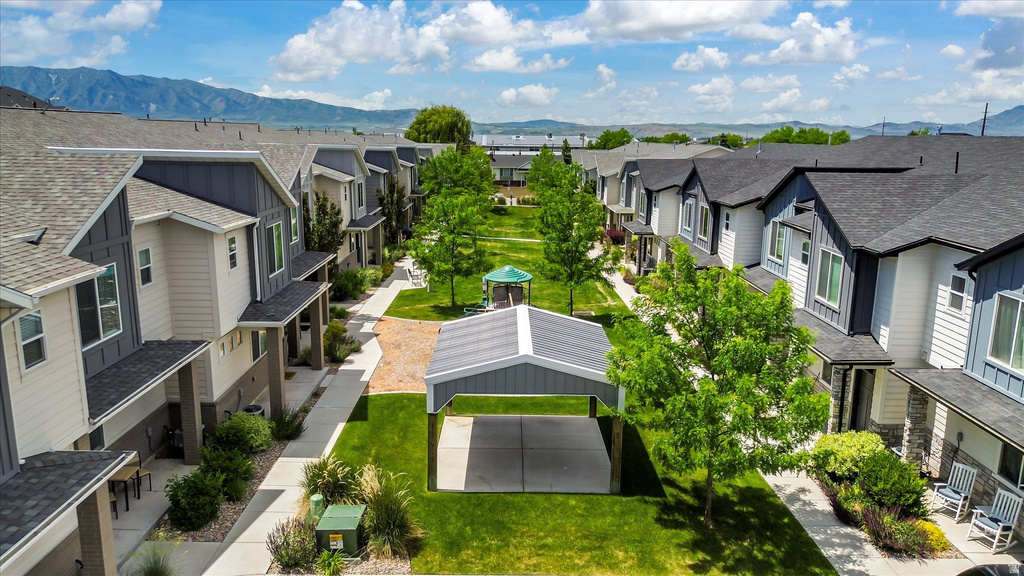 Modern townhome community featuring varied architectural facades, asphalt shingle roofing, and covered entryways