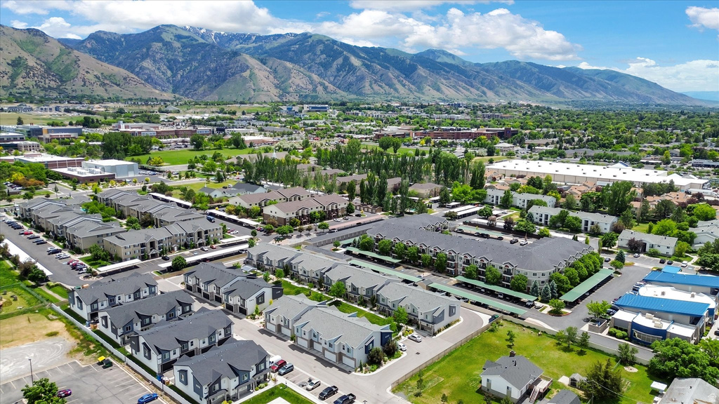 Aerial perspective showcasing a residential community with multi-story buildings and townhomes