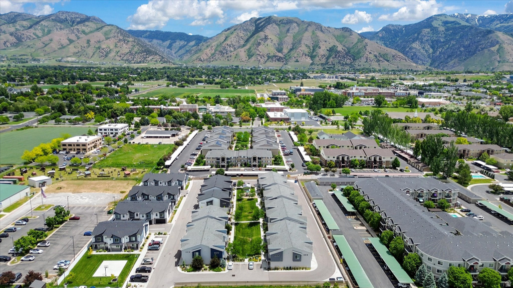 Expansive residential community featuring multiple modern buildings with dark roofs and light-colored siding