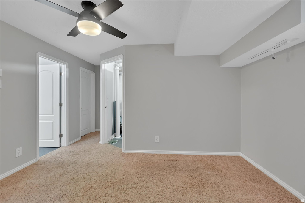 Carpeted room with light gray walls and white trim