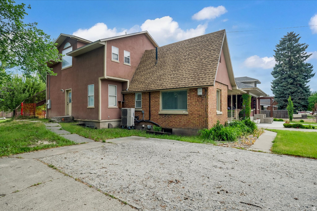 Property exterior featuring stucco and brick construction