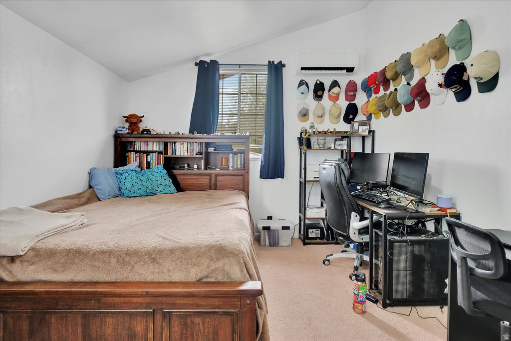 Bedroom featuring a built-in wooden headboard with shelving, window with blue drapery, wall-mounted air conditioning unit, and light-toned carpet flooring