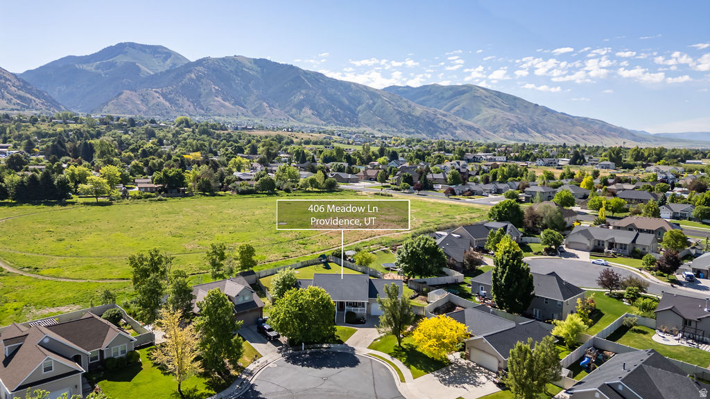 Aerial perspective showcasing a residential cul-de-sac with manicured lawns and mature trees