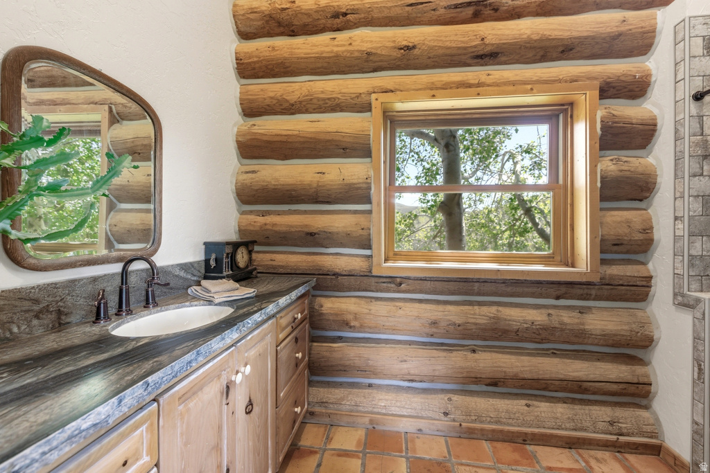 Log wall construction featuring a wood-framed window