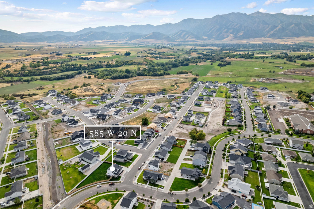 Aerial view of a residential community featuring single-family homes with landscaped yards