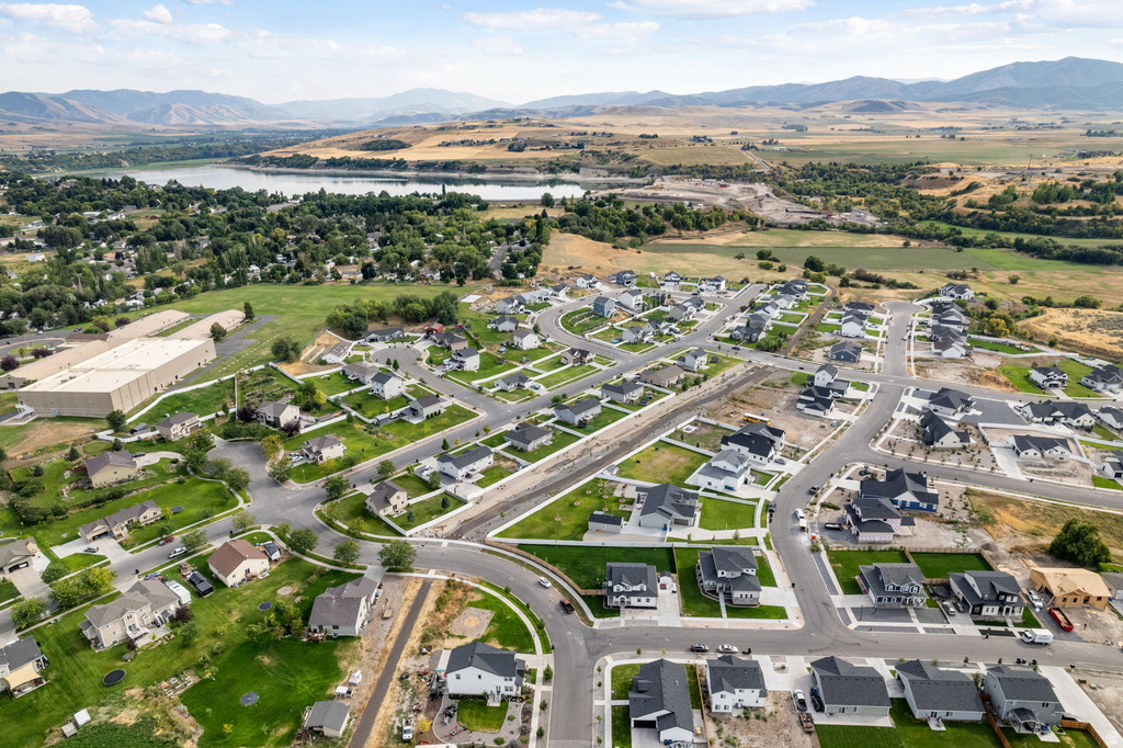 Expansive residential development featuring modern homes with dark roofs and light-colored siding