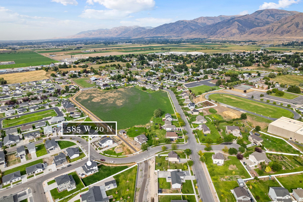 Aerial overview showcasing residential properties and surrounding landscape