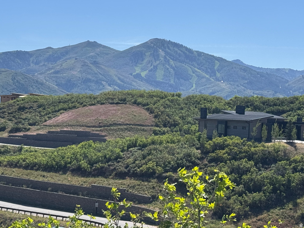Contemporary architectural style residence set into a hillside with multiple retaining walls