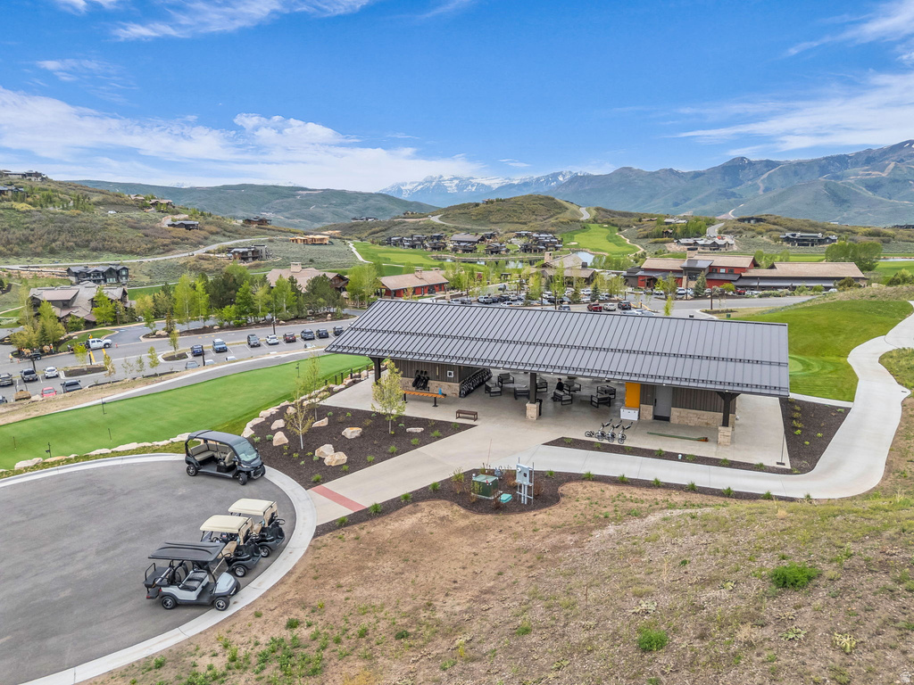 Open-air pavilion featuring a standing seam metal roof and stone veneer accents