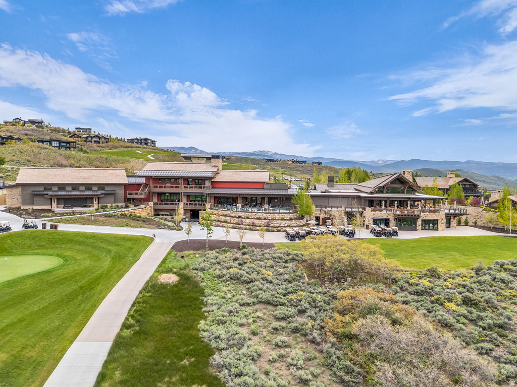 Expansive multi-building complex featuring varied architectural styles and natural stone accents