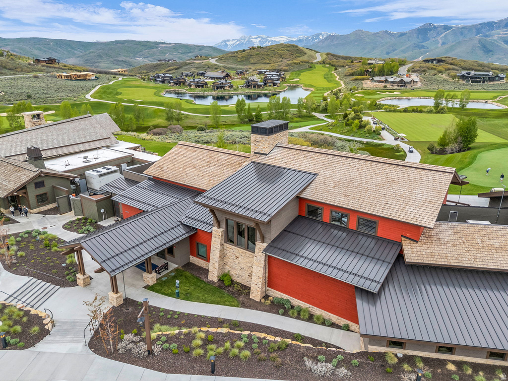 Contemporary architectural design featuring a combination of natural stone and vibrant red siding