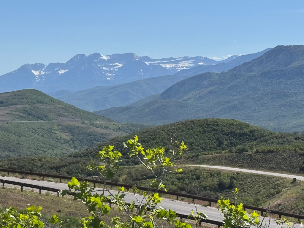 Sweeping mountain range backdrop with distant snow-capped peaks