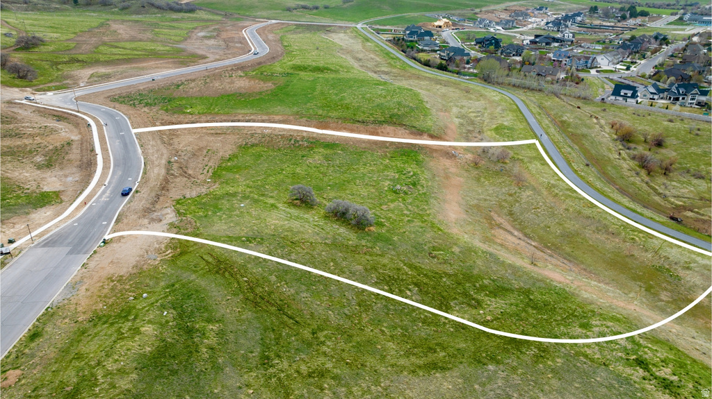 Expansive land parcel featuring existing paved roads and sidewalks