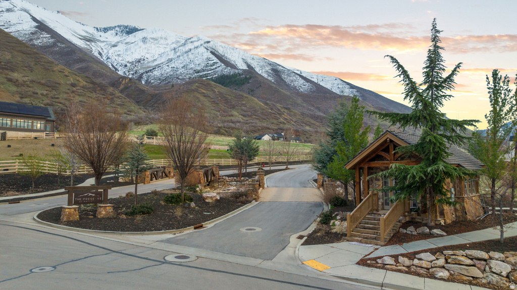 Entryway structure featuring natural stone veneer and exposed timber framing