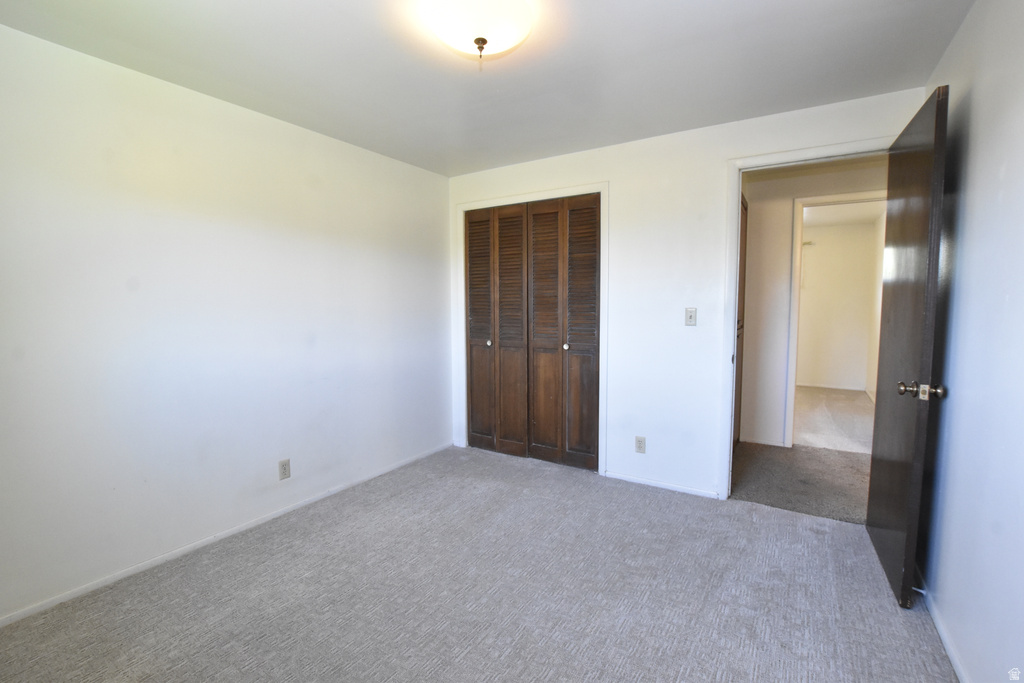 Neutral-toned wall paint and light-colored carpet flooring create a bright interior