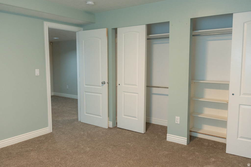 Wall-to-wall carpeting and neutral wall paint