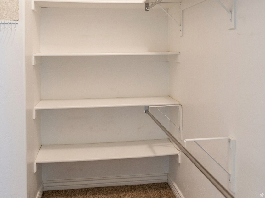 White-painted shelving units providing storage