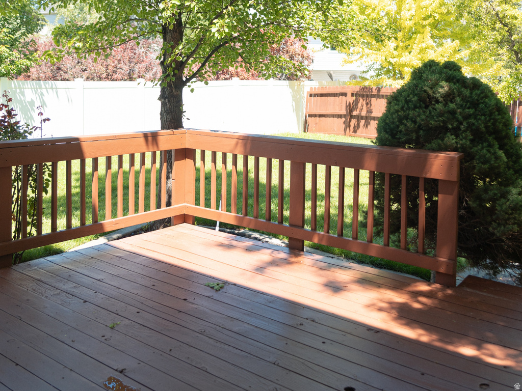 Spacious wood deck with a full railing system