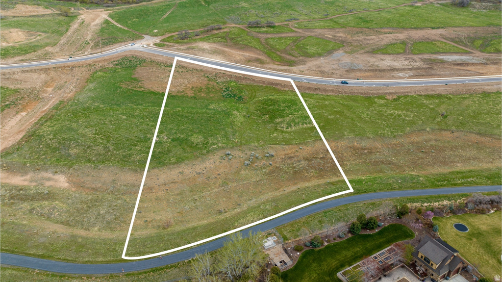 Expansive land parcel featuring varied topography and green space