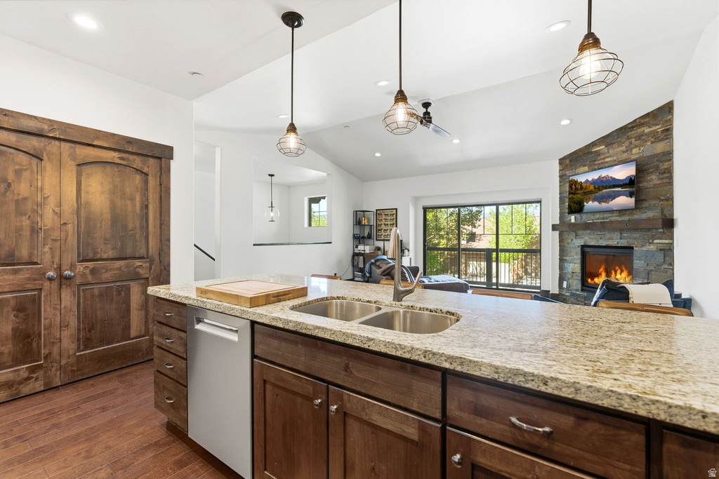 Kitchen island featuring an undermount double-basin stainless steel sink and a gooseneck faucet