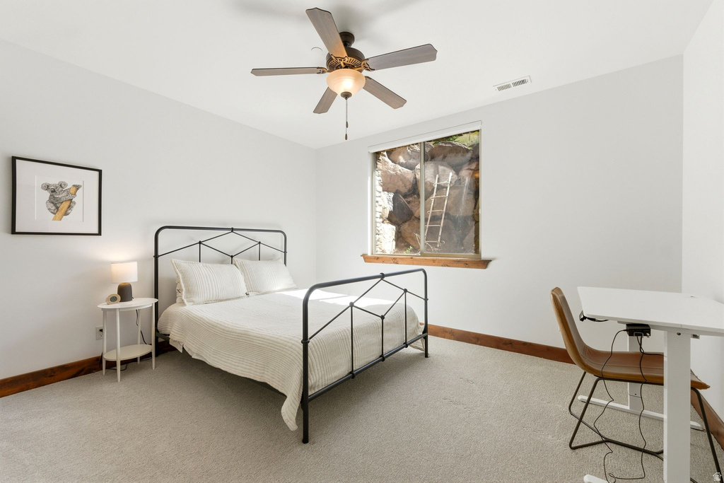 Neutral wall tones complement the light-colored carpet flooring