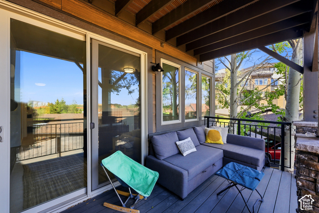 Covered outdoor deck with dark composite flooring