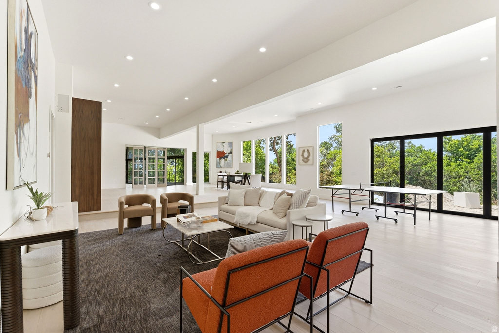 Spacious interior featuring high vaulted ceilings, recessed lighting, and light wood-finish flooring