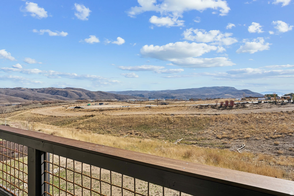 Expansive outdoor panorama featuring distant mountains and open terrain