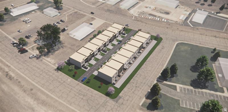 Modern townhome development with contemporary architecture, individual garages, private patios, and landscaped common areas