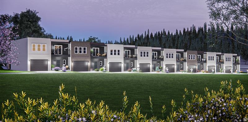 Contemporary townhome row featuring diverse exterior finishes including light siding, dark siding, and dark paneling