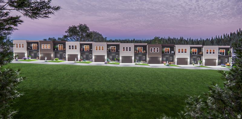 Contemporary townhome exteriors featuring varied facade treatments, integrated garage doors, upper-level balconies, and a manicured lawn
