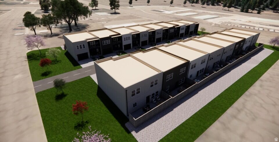 Modern townhome development featuring a consistent architectural design, private rear patios, and attached garages