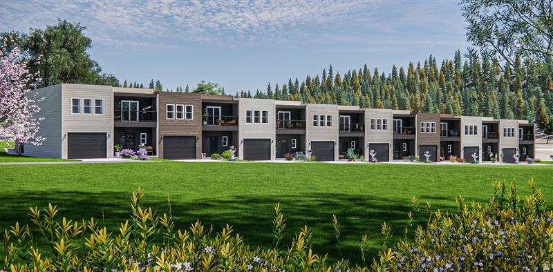 Contemporary townhome community featuring varied facade materials, individual garage access, private balconies, and surrounding mature trees