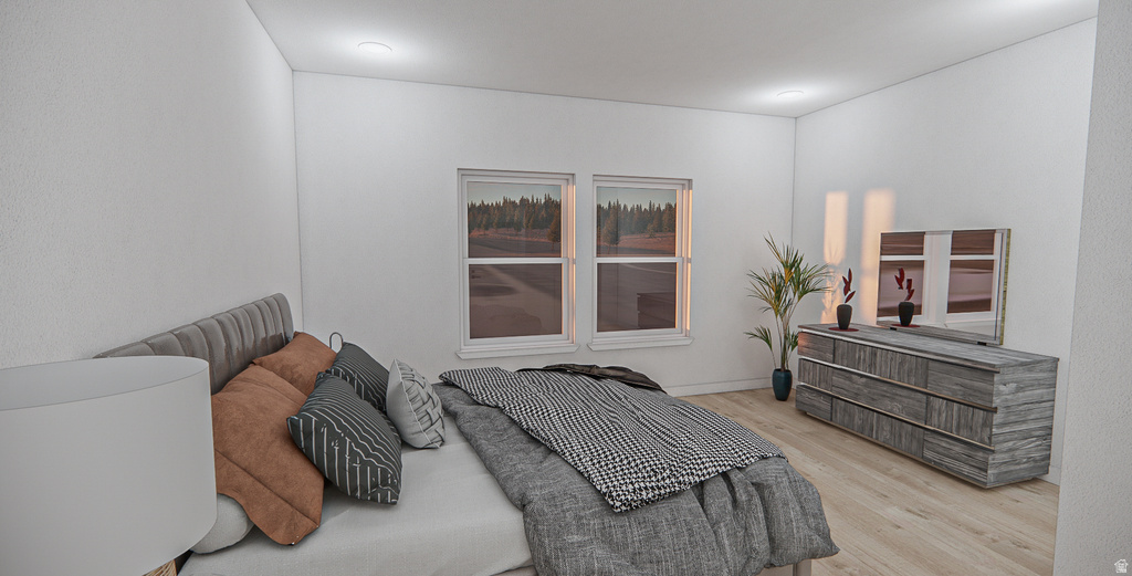 Spacious room featuring light wood-finish flooring, white walls, two windows, and recessed lighting