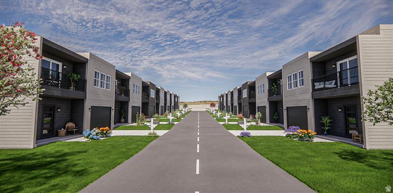 Contemporary townhome row featuring dual-tone siding, private balconies with black railings, ground-level garages, and manicured lawns with planted landscaping