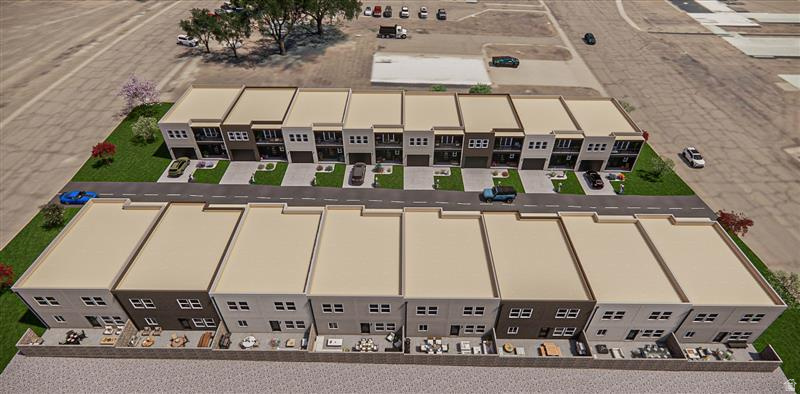 Modern multi-story townhomes featuring contemporary facades with varying exterior finishes, individual garage entries, and private rear patios