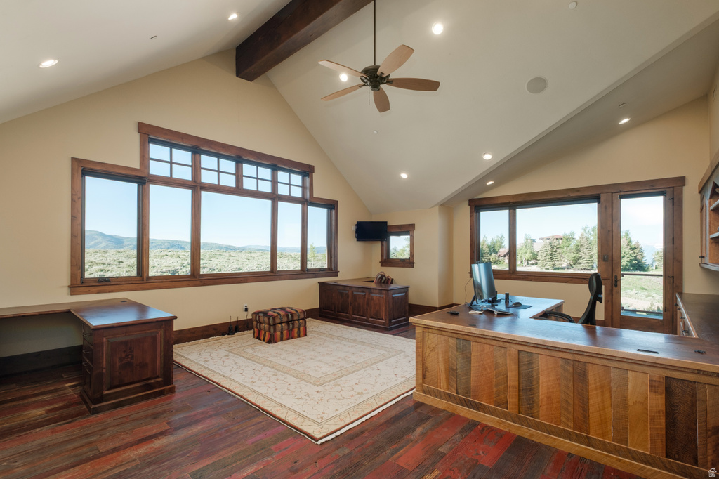 Room with vaulted ceilings and wood-finish flooring