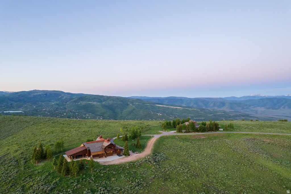 Expansive property featuring two distinct structures nestled in a vast, open landscape