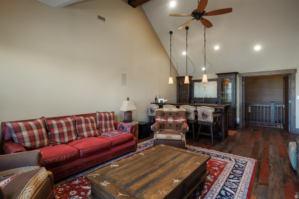 Vaulted ceiling great room featuring recessed lighting and a ceiling fan