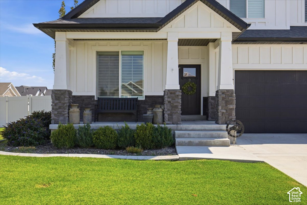 Exterior featuring vertical siding and stone accents