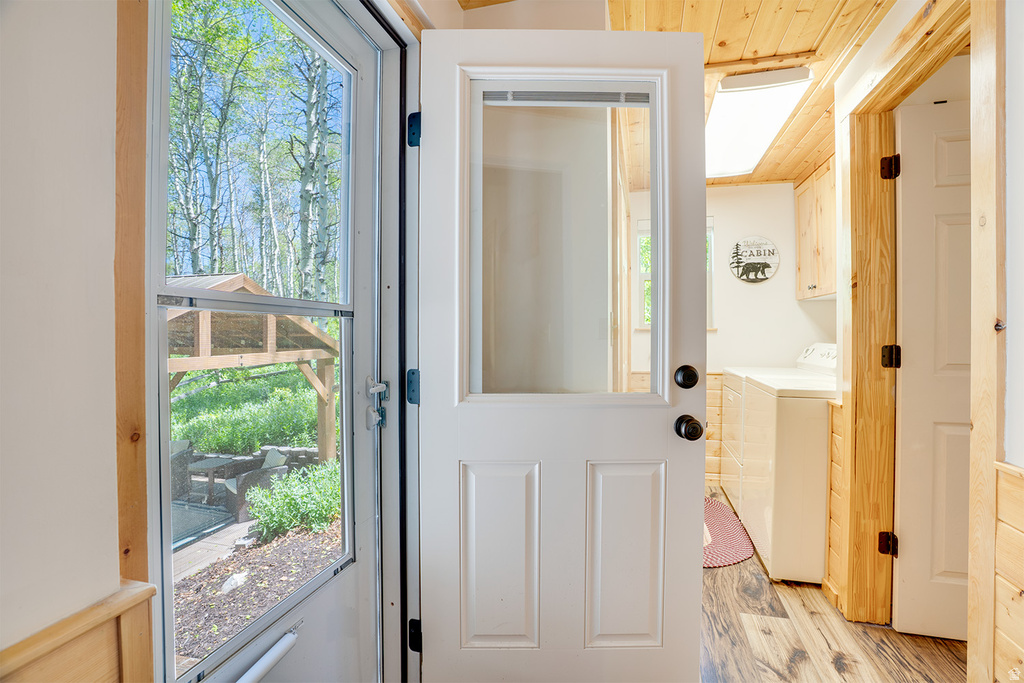 White paneled exterior door with glass insert
