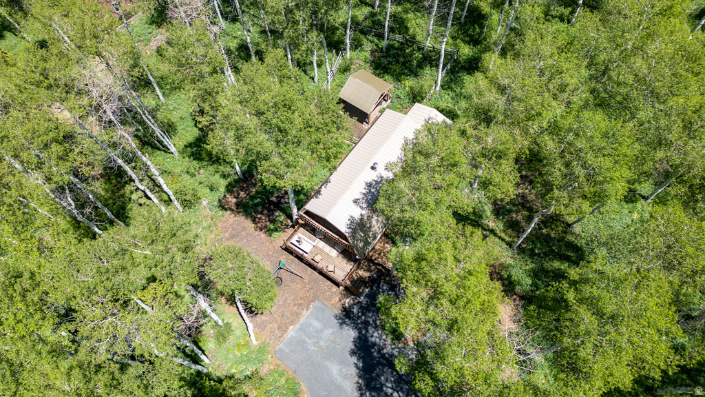Aerial property view showcasing a residence nestled within dense, mature foliage