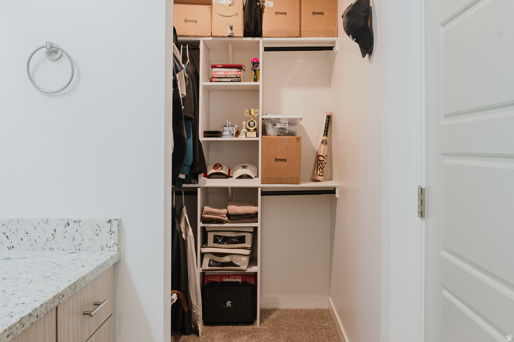 Built-in closet system featuring multiple shelving units and hanging rods