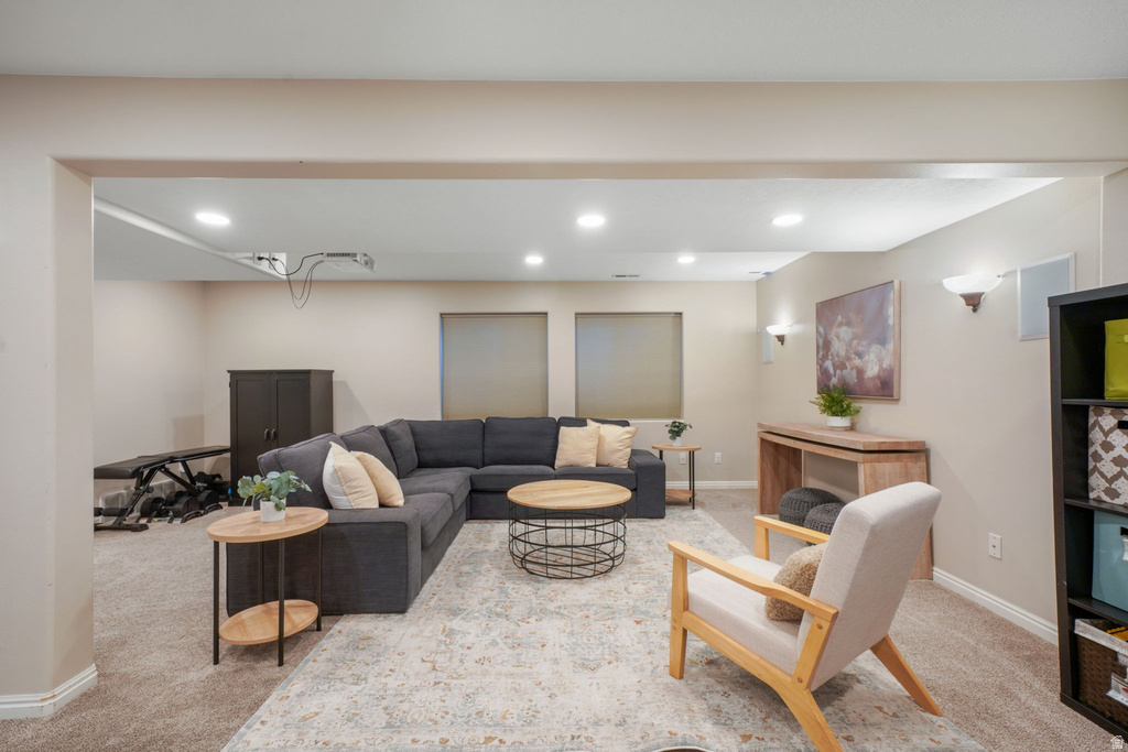Expansive recreational room featuring recessed lighting, sconce lighting, and carpet flooring