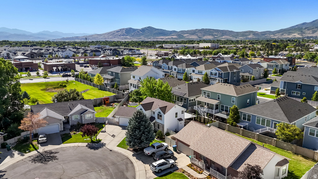 Neighborhood setting featuring established residential properties, a cul-de-sac, paved streets, and mature landscaping